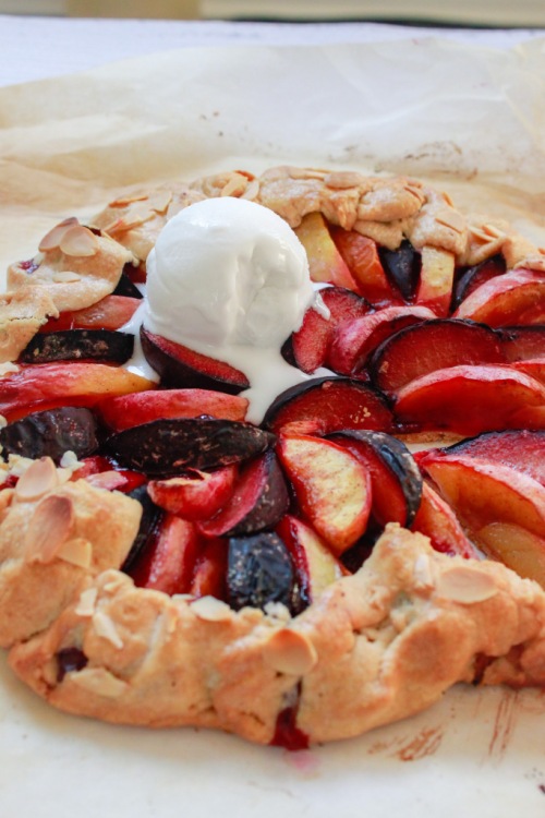 gluten free stone fruit galette with a scoop of ice cream